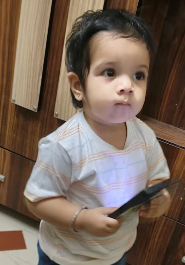 A happy family after using mySunar's ear piercing service in Ahmedabad