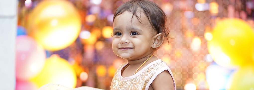 A happy family after using mySunar's ear piercing service in Chennai