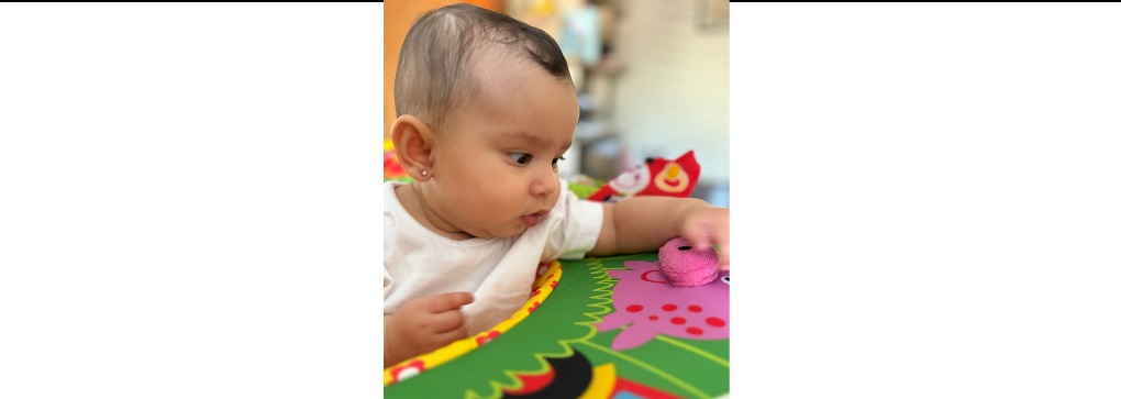 baby after a gentle ear piercing at home in Mumbai by mySunar