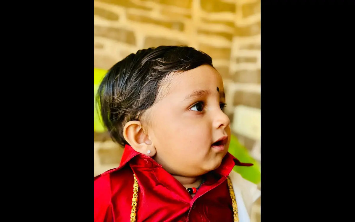 Happy family after baby ear piercing - mySunar Dubai NRI service